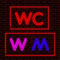 Neon WC signs. Male and female symbols. Toilet symbols Royalty Free Stock Photo