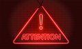 Neon word Attention Symbol Sign on Red brick wall background. Security protection, Malware, Hack Attack, Data Breach Concept. Royalty Free Stock Photo