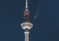 Neowise Comet visible in city of Berlin over TV tower with illuminated night sky. Astro photo during night time with Royalty Free Stock Photo