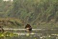 A man and a woman on a dugout boat. Royalty Free Stock Photo