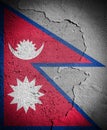 Nepal flag on cracked wall