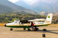 Nepal, Himalayas, Jomsom Airport - April 2015: Tourists and local people flew on a small plane to the airport in the mountains