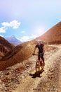 Nepal, Himalayas, the kingdom of Upper Mustang - April 2015: A mountain bike cyclist descends the mountain road