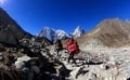 Nepalese carrying Luggage trekking on the way to everst base camp