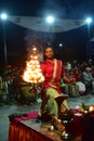 Nepalese Hindu priest performing Aarti ceremony at the lakeside in Pokhara, Nepal