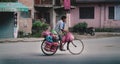 Nepalese Man Riding His Bicycle Full of Vegetables to Sell Across Thamel Street Royalty Free Stock Photo