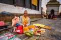 Nepalese man selling religious tools in ancient Pashupatinath Temple