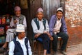 Nepalese men mingle on the side of the street Royalty Free Stock Photo