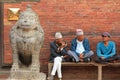 Nepalese men sitting at the entrance to the Patan Museum in Nepal