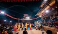 Nepalese people performing and watching traditional dance called Kartik Naach during night time