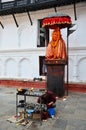 Nepalese people pray with Hanuman statue at Basantapur Durbar Square