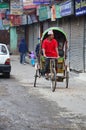 Nepalese people riding tricycle at street of thamel market