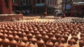 Nepalese people are shaping and drying up ceramics pots in Pottery Square