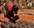 Nepalese people are shaping and drying up ceramics pots in Pottery Square