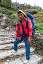 Nepalese porter carrying heavy load. Royalty Free Stock Photo