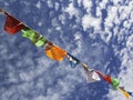 Nepalese prayer flags against the blue sky.