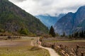 Nepalese Sherpa Hiking Mountain Trail Village.Old Man Walking Loaded Bags Track Traveler Beautiful Noth Asia.Himalaya