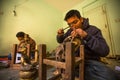 Nepalese tinman working in the his workshop, in Bhaktapur, Nepal.