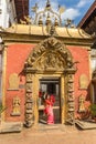 Nepalese woman posing in the Golden Gate in Bhaktapur Royalty Free Stock Photo