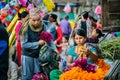 Nepalese woman selling flowers at a local market in Nepal Royalty Free Stock Photo