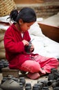 Nepalese woman working in the her pottery workshop