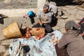 Nepalese women chopping yak meat