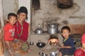 A Nepali Limbu Family having dinner in traditoinal Nepalese Kitchen