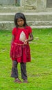 Nepali little girl in dirty clothes