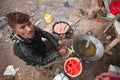 Nepali man cooking snacks, Bardia, Nepal