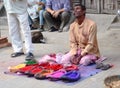 Nepali man selling colorful face powder Royalty Free Stock Photo