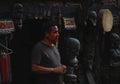 Nepali Man Selling Traditional Wooden Statue at Thamel Street