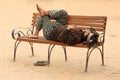 Nepali man sleeping on a bench in Kathmandu, Nepal on April 06, Royalty Free Stock Photo