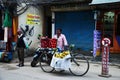 Nepali man vendor push bicycle cart hawker on road sale variety fruits and food to nepalese people and foreign travelers eat drink