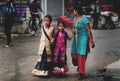 Nepali Mother Guide Two of Her Daughter Who Wearing Traditional