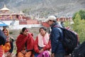 Nepali people and a temple in the background