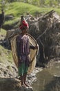 Nepali Taru woman fishing with net