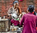 Nepali woman selling local drinks Royalty Free Stock Photo