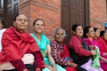 Nepali woman sitting in the city center of Bhaktapur Royalty Free Stock Photo