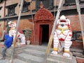 Nepali worker people renovate repair build scaffolding structure at ancient ruin antique building of Royal Kumari Ghar Palace or