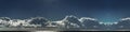 Nephology art. A beautiful panoramic cloudscape scene, with white Cumulonimbus cloud in a mid blue sky