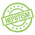 NEPOTISM text written on green vintage stamp