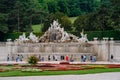 Neptune Fontain viewed from the garden of Schonbrunn palace in the city of Vienna, in Austria