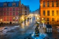 Neptune Fountain and a Christmas decorations in snowy old town of GdaÃâsk. Poland Royalty Free Stock Photo