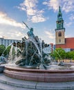 Neptune fountain (Neptunbrunnen) on Alexanderplatz square at sunset, Berlin, Germany