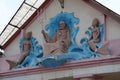 Neptune and mermaids. Bas-relief on old building, Ivano-Frankivsk, Ukraine