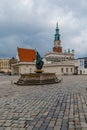 Neptune`s Fountain at market square at cloudy day