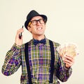 Nerd broker man holding money and talks by phone. Forecasting financial rates. Bad finance news