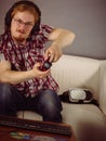 Gamer man playing using gaming pad Royalty Free Stock Photo