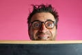 Nerd man crazy behind blackboard funny gesture