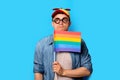 Nerd man with noob hat holding a rainbow flag